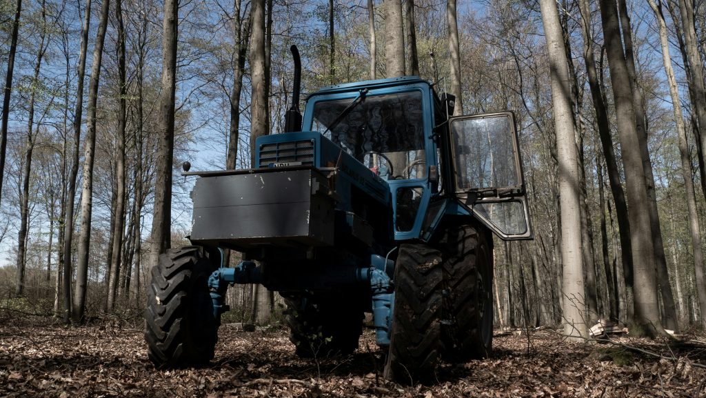 forestry machine in blue and specialized tracks
